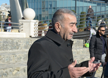 Baku residents bringing flowers to Seaside Boulevard to honor missing oil workers.  Azerbaijan, Dec.07, 2015